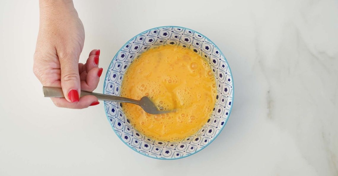 Beating eggs for egg fried rice